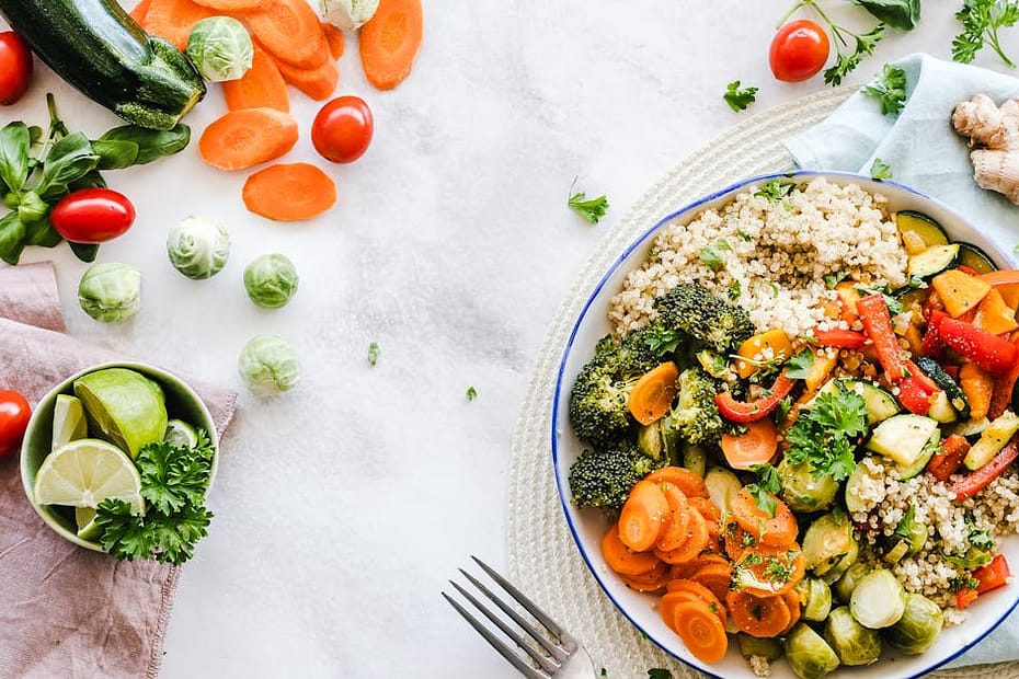 Colorful quinoa salad with fresh vegetables creates a healthy, balanced meal.