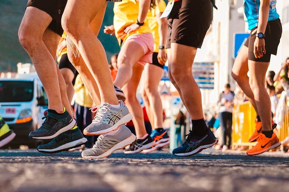 Group of runners participating in a city marathon during daylight.